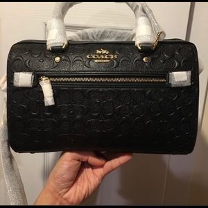 Coach black debossed Purse